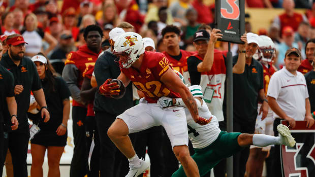 Iowa State tightened Tyler Moore (82) tries to break Ohio corner back Roman Parodie s (4) tackle during the game at Jack Trice Stadium in Ames, Iowa on Saturday, Sept. 17, 2022. The Cyclones defeated the Bobcats, 43-10.